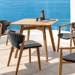 knit-dining-table-small-ethimo-core-furniture-product-1 Ethimo's Knit range small dining table with dining chairs by the sea.