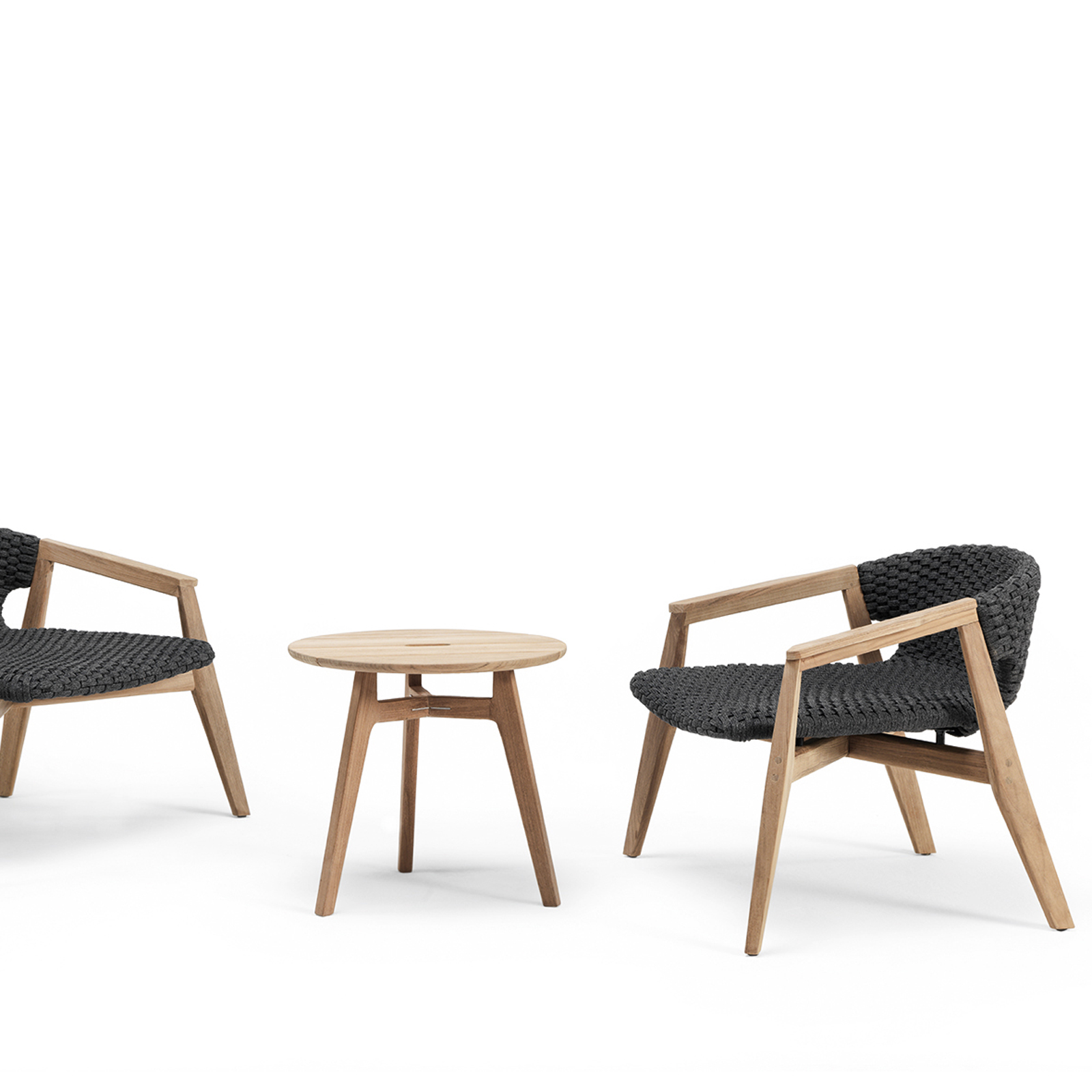 Ethimo's Knit collection lounge armchairs and side table.