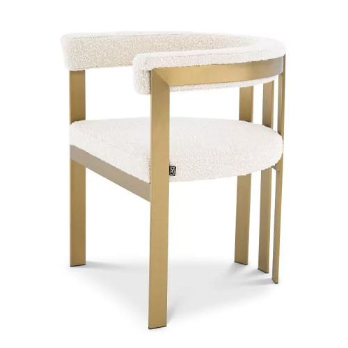 Luxurious Dining Chair Clubhouse by Eichholtz in boucle cream with brushed brass frame, savona grey velvet with brushed brass frame or savona midnight blue velvet with polished stainless steel frame