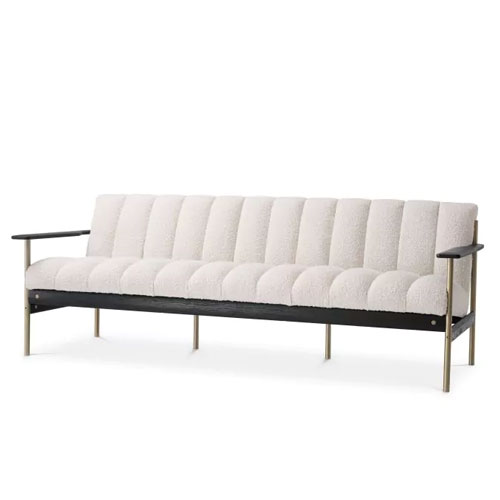 Designer luxurious Sofa Elan by Eichholtz in boucle cream upholstery finish with brushed brass and black finish. Features deep-channel stitching