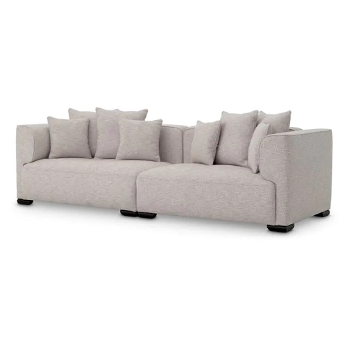 Luxurious designer Sofa Xylon by Eichholtz in attesso beige with black feet. Includes cushions